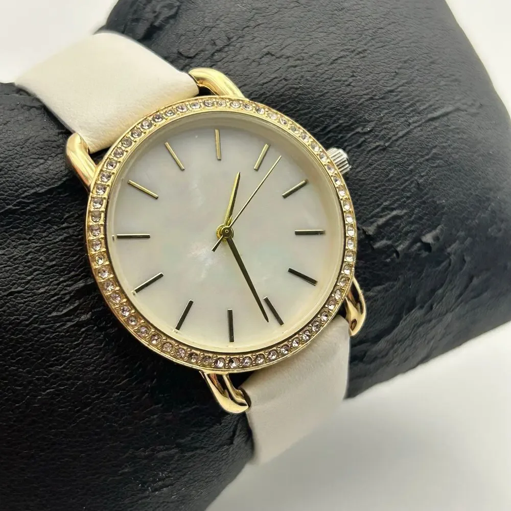 Women’s Gold-tone Crystal Bezel Mother Pearl Dial White Band Minimalist Watch